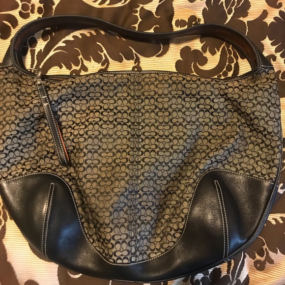 This is a coach hobos hand bag black and gold in color - Picture 3 of 3